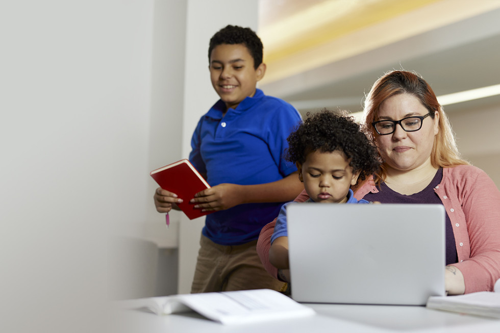 A student studying with their child. 